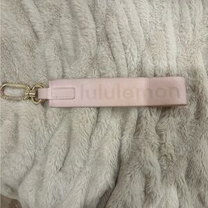 Lululemon key chain. Stained on the fabric see pics